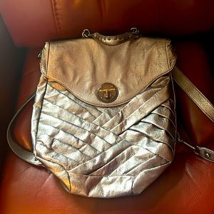 Elliott Luca space age silver backpack w/metal detailing.